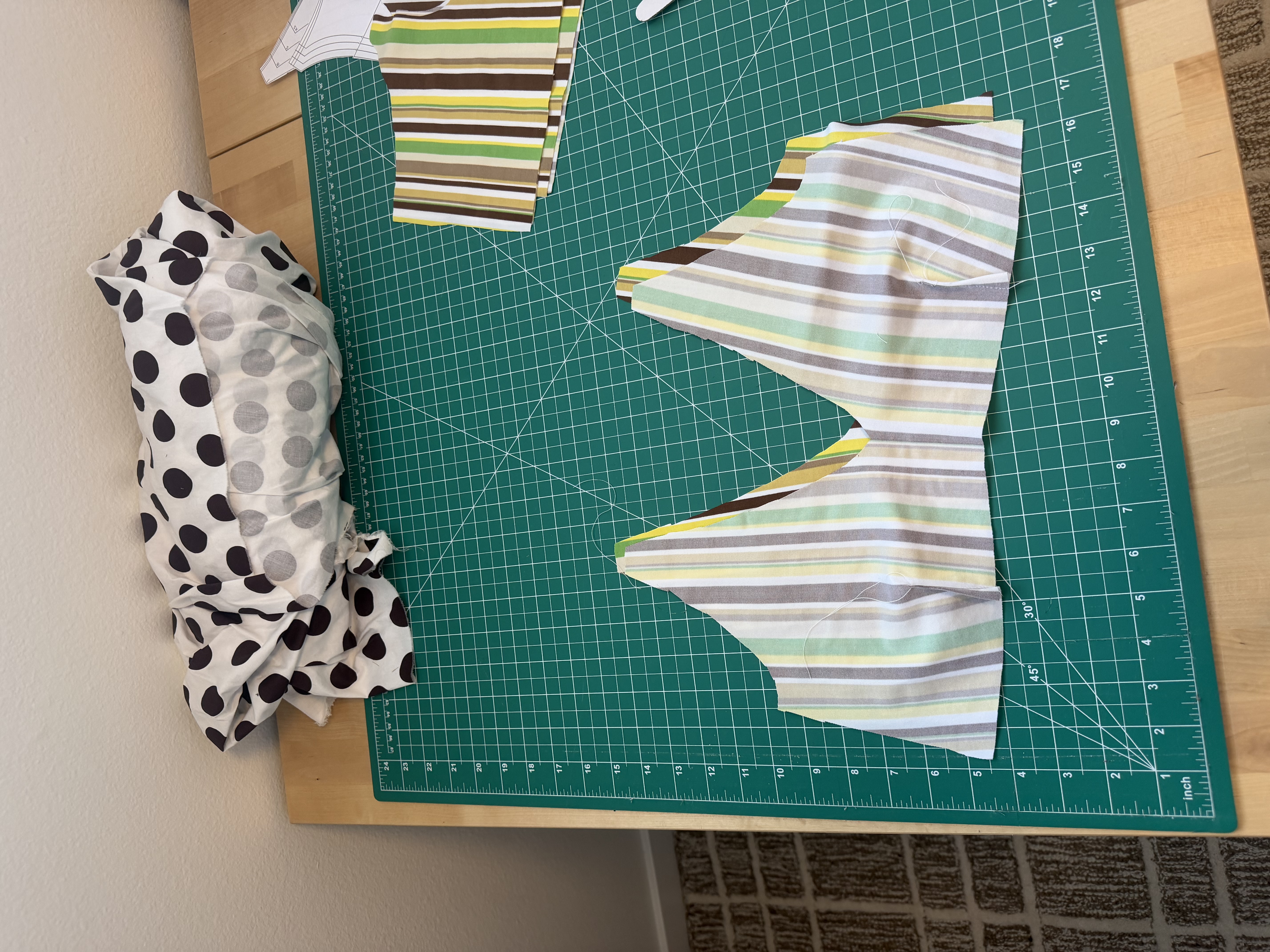 Striped Finley top pattern pieces cut and ready to sew, with the center bust dart visible